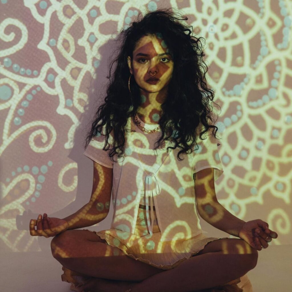 curly hair woman meditating