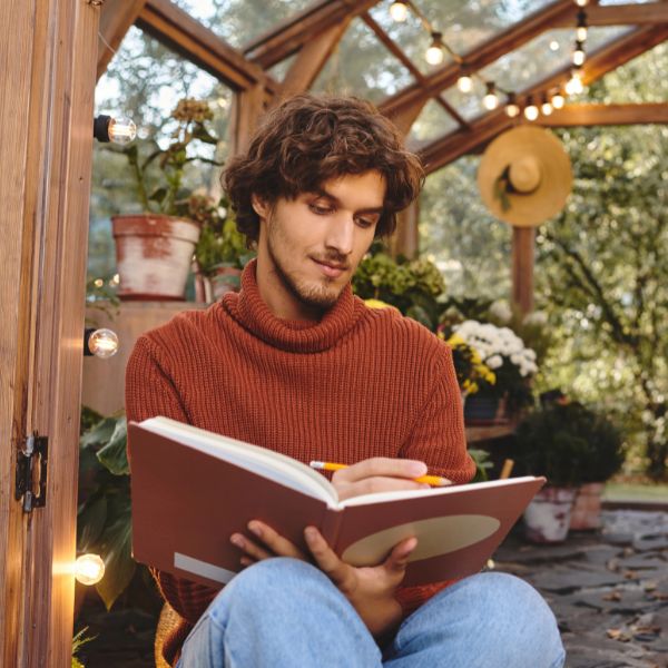man sketches nature
